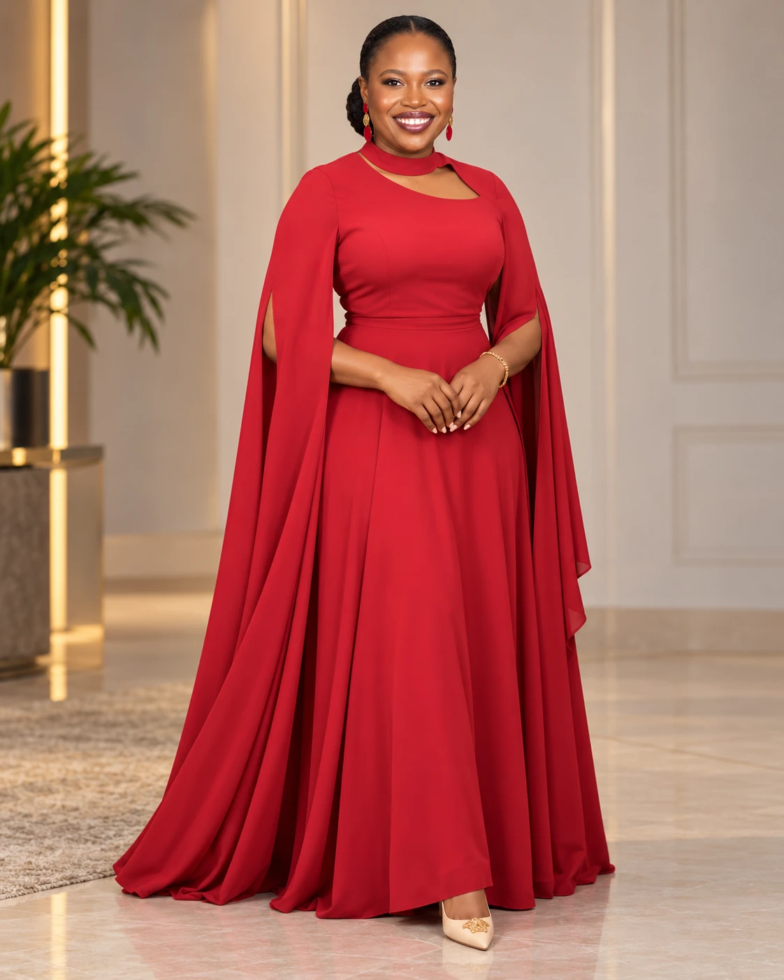 Regina smiling in a red dress